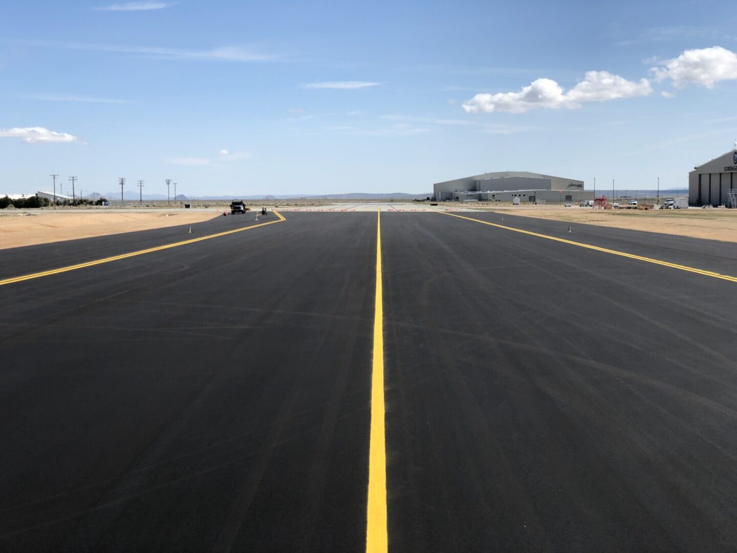 Airport runway with yellow markings